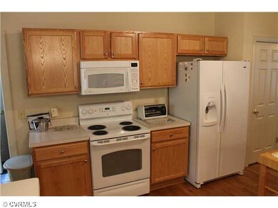 Kitchen - Oak cabinets, hardwood floors, slide out