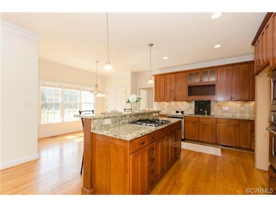 Kitchen Island has a Gas Cooktop with Downdraft ve