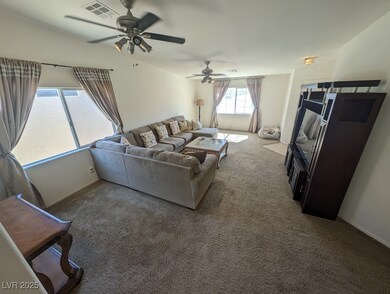 Living area featuring carpet floors and visible ve