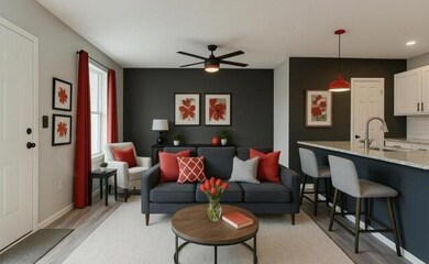 Living room with recessed lighting, ceiling fan, b