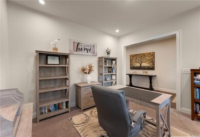 Office featuring light carpet, recessed lighting, 