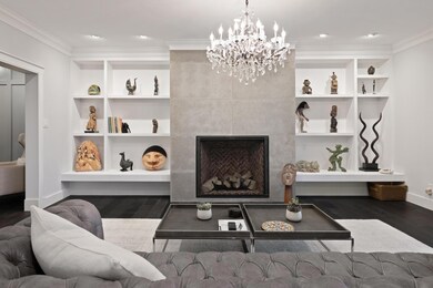 Living room with baseboards, wood finished floors