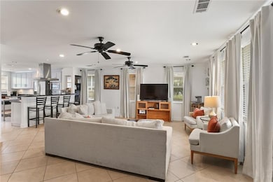 Living room view highlighting the natural light throughout