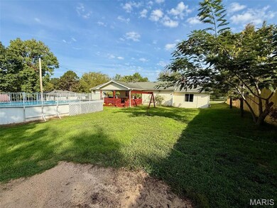 View of yard featuring a wooden deck