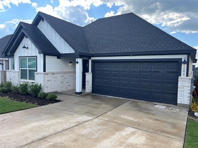 View of front facade with an attached garage, boa
