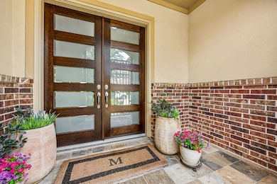 Gorgeous double French doors make an impressive fi