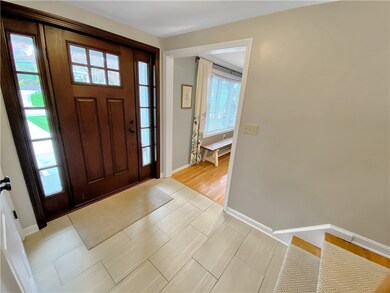 Ceramic tile entry with stylish front porch.