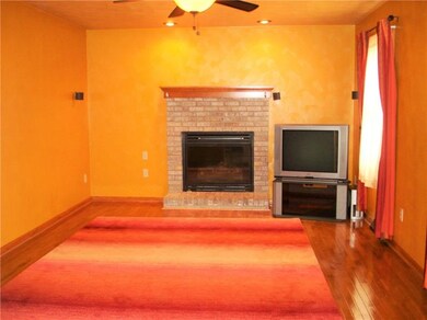The cozy family room off of the kitchen features a