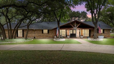 View of front of house featuring brick siding, a 