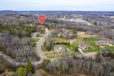 Nestled in the trees in the desirable, gated community of Carter Creek. This neighborhood is conveniently  located to shopping, schools, restaurants and more in Hendersonville, TN. 