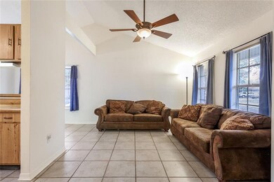 Just off the entrance is a tiled floor living room