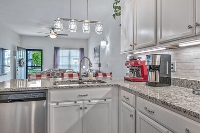 Upgraded kitchen with granite countertops, tile back spash, upgraded faucet, upgraded lighting