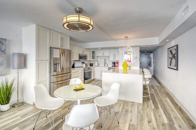 Dining area featuring a textured ceiling, sink, an