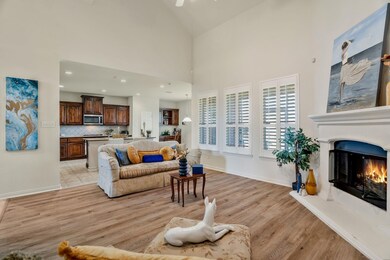 Living area with recessed lighting, a ceiling fan,