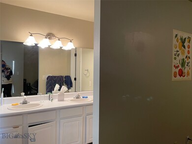 Master vanity, note door visible (in mirror) to ad