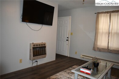Large flat screen TV in living room mounted over a