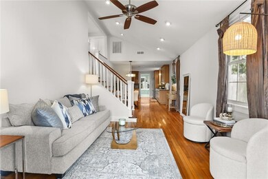 Living Room with hardwood floors, vaulted ceilings