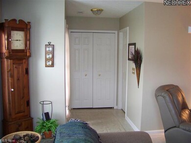 Enter Home to the left of the coat closet doors.