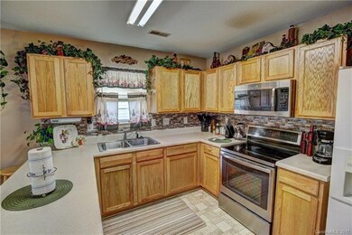Lots of Kitchen cabinets and counter top space. Ne