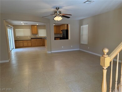 Unfurnished living room featuring ceiling fan and