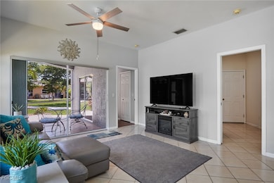 Living room featuring light tile patterned floors,