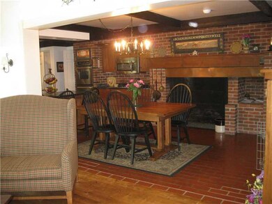 Kitchen. Breakfast room w/ fireplace opens to both