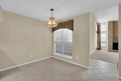Unfurnished dining area with a chandelier, light t