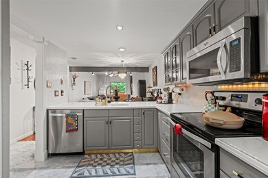 Kitchen featuring appliances with stainless steel