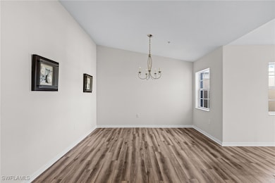 Unfurnished dining area with hardwood / wood-style