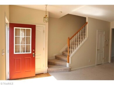 Living Room. Bright entryway into the lviing room. New paint. New carpet downstairs.