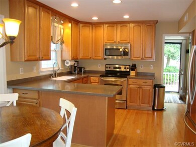 Kitchen with stainless steel appliances, hardwood 