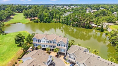 Drone / aerial view of a large body of water and a golf club