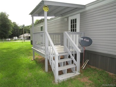 COVERED DECK ON BACK OF HOUSE