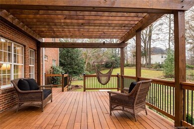 Upgraded deck with metal rails, custom pergola, an