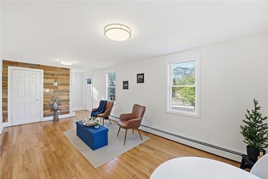 Living room with feature wall and basement access