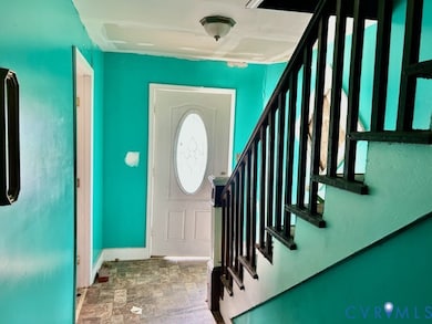 Foyer with stairway and stone finish flooring