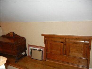 Notice the antique dresser built in wall.