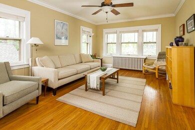 Sunny and bright living room, with gleaming hardwo