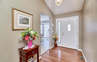 Entry foyer greets you with gleaming hardwood floo