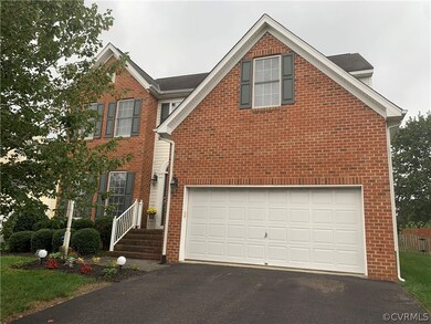 Two car garage and paved driveway