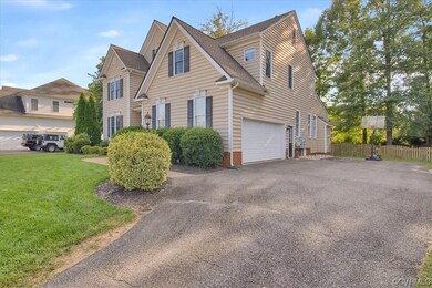 View of side of property with garage and double wi