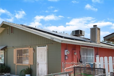 View of property exterior with roof mounted solar