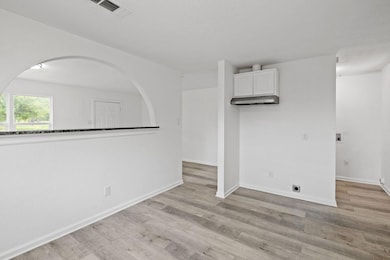 Unfurnished room featuring light wood finished fl