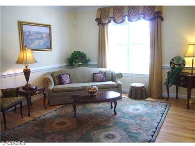 Living Room - Wood floors, chair rail & crown mold