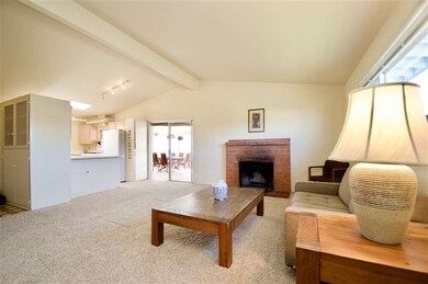 The living room is open to the kitchen.