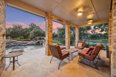 End the day on the extended covered patio with stunning views of this serene space.