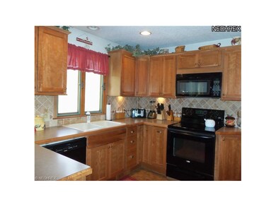 Beautiful Hickory Kitchen with ceramic floors and 