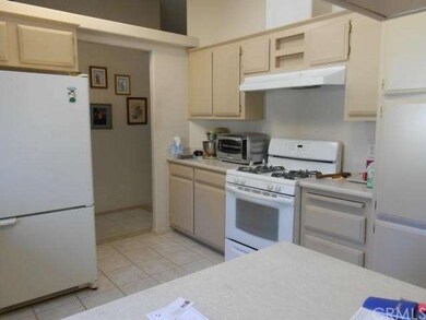 Kitchen has lots of cupboards. 