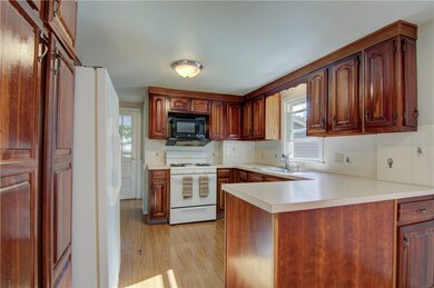 Kitchen view showing door out toward garage.