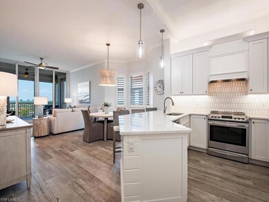 Kitchen with designer fixtures and stylish backspl